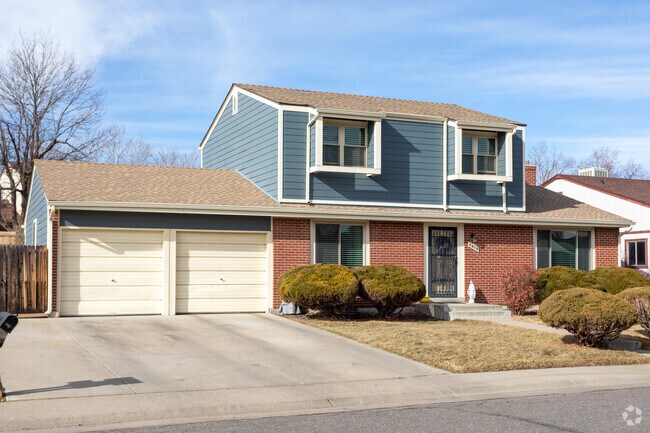 This two story home in Pheasant Run features a large yard and a two car garage.