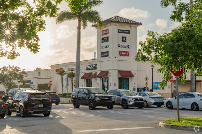 Tanger Outlets near Lake Belvedere Estates feature major national retailers.