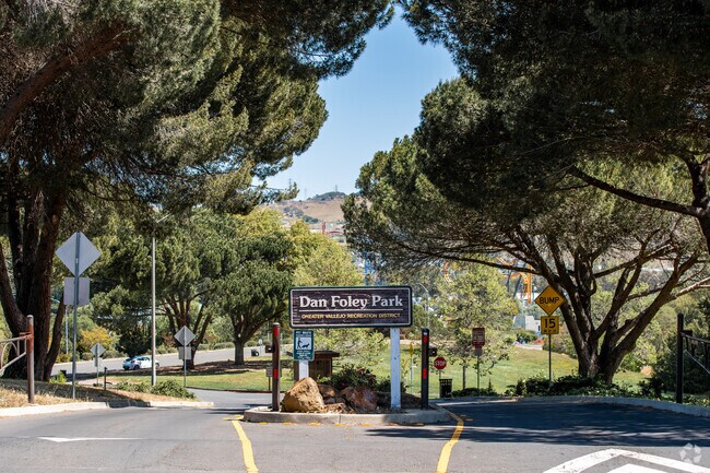 The Dan Foley Park Entrance is encapsulated by trees.