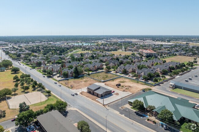 The Wester neighborhood is dotted with various style homes, greenery, and bodies of water.