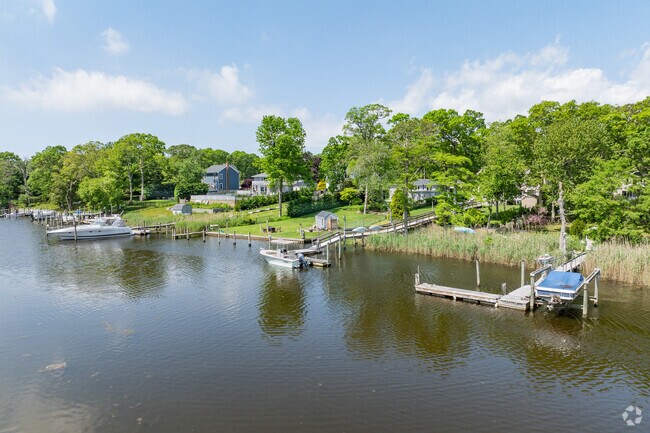 Relax with life on the water overlooking the Forge River in Moriches.