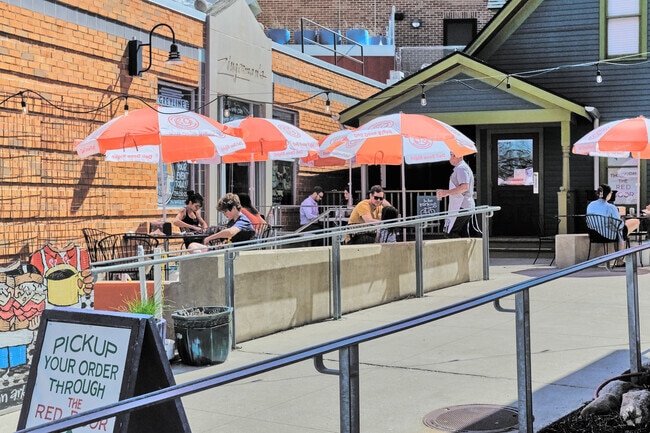 Locals are enjoying the weather on the patio of Zingerman's Delicatessen, near North Area.