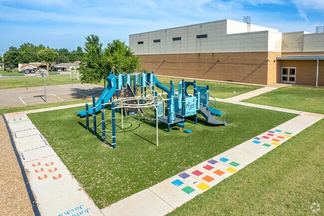 Students stretch their legs on the playground at Coolidge Elementary School.