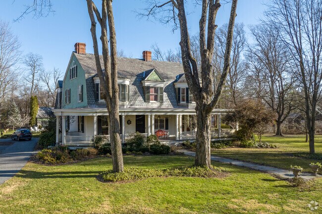 Dutch Colonial Revivals are an older housing style that can sometimes be found in Lochearn.