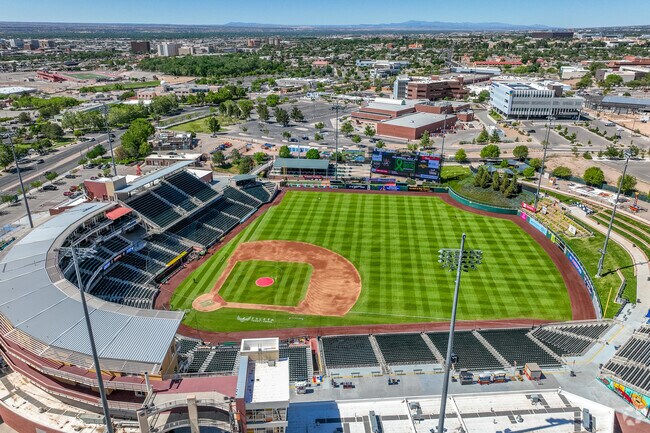 The Isotopes are the Triple-A minor league affiliate of the Colorado Rockies and play at Isotopes Park in Clayton Heights-Lomas del Cielo.