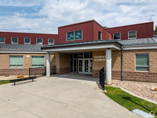 Cement pillars frame the entrance at Daybreak Elementary.
