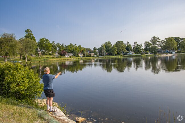 Locals fish from the banks or small boats, using the stillness of Lake Carmel as their weekend reset.