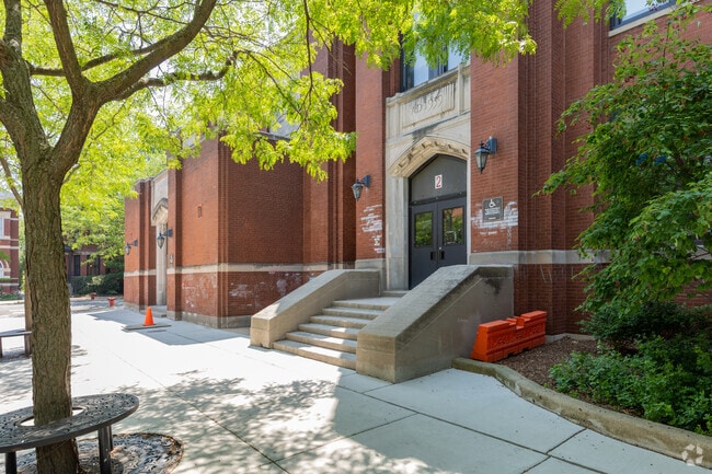 Main entrance tree lined streets with sitting at the trees, Lincoln Elementary School, Chicago.