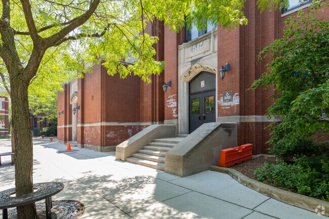 Main entrance tree lined streets with sitting at the trees, Lincoln Elementary School, Chicago.