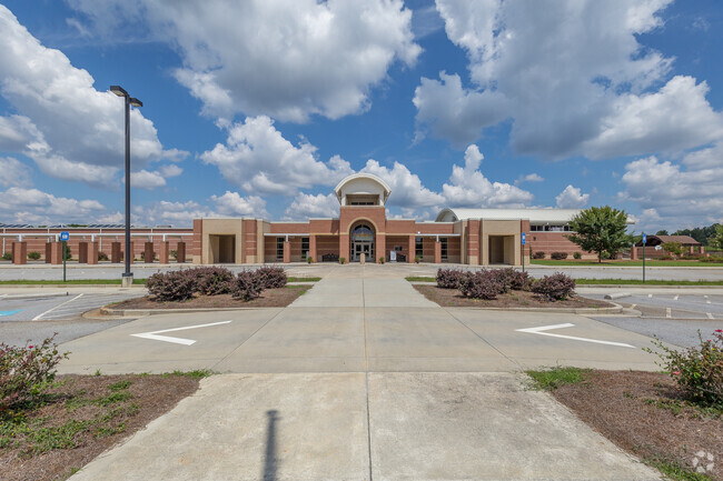 Paved pathways lead students to the entrance of Loganville Elementary School in Loganville.