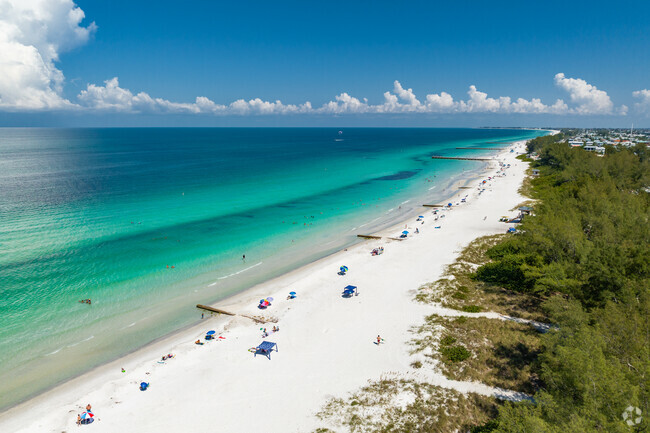 Beautiful Coquina Beach in Bradenton Beach with aqua blue water as far as the eye can see.