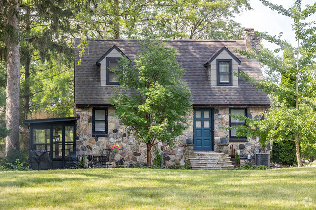 Unique stone Cape Cod style homes can be found within Forest Hills View.