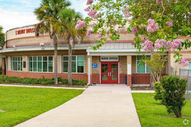 Students attending T. Dewitt Taylor Middle and High School walk through the double doors.