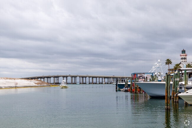 Boats come and go day and night at the marina at Harborwalk Village in Destin.