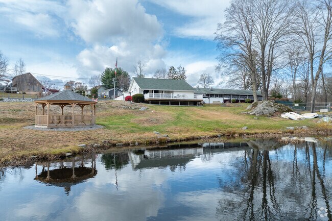 Camp Louis Marcucio features a scenic pond for outdoor activities.