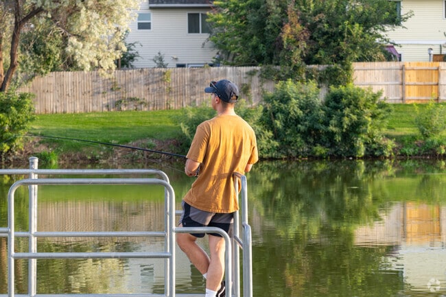 Locals fish at lakes surrounding the neighborhood in Kelly Farm, Greeley.