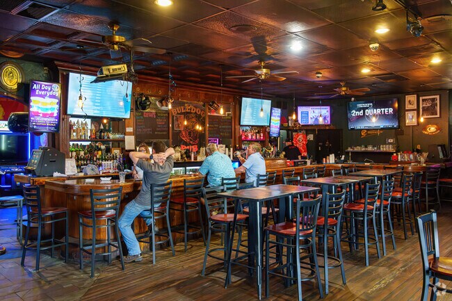 Plantation Estates locals relax with drinks at Bulldog Pub.