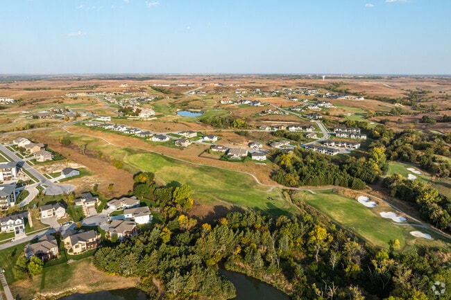 Houses in Grand Mere are surrounded by prairie grasses and the beautiful golf course landscape.