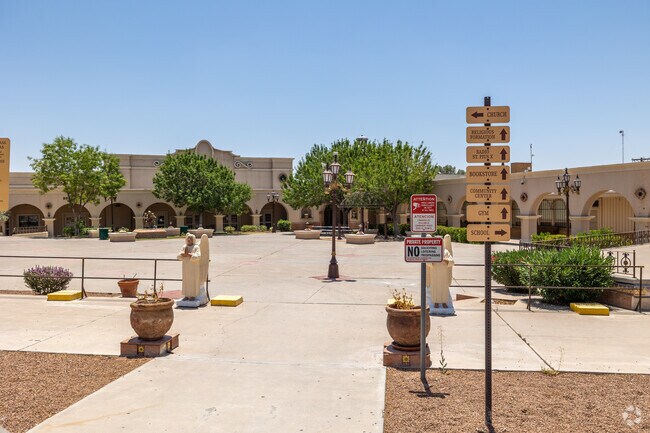 Courtyard paths and shade trees define the peaceful campus at St. Pius X School.