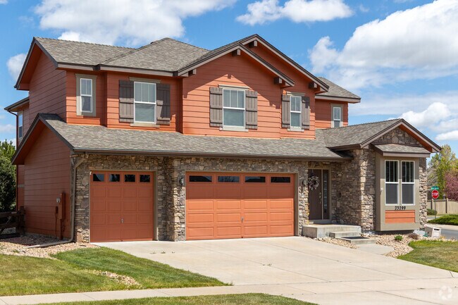 This craftsman style home in the Villages of Parker boasts amazing stone work.