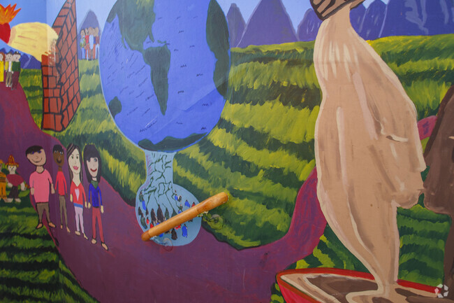 A colorful mural painted by the talented children at Paulo Freire Freedom School.