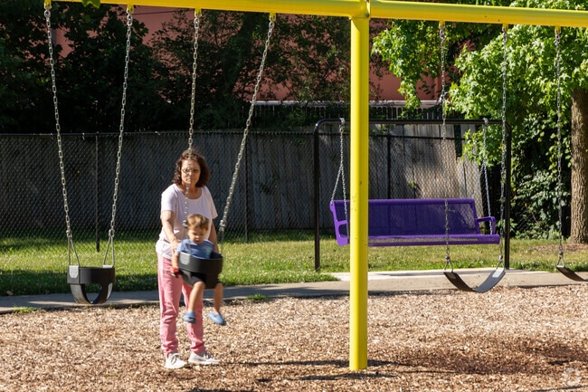 Arlington Park has a swingset for the kids and a bench to rest on in Lafayette.