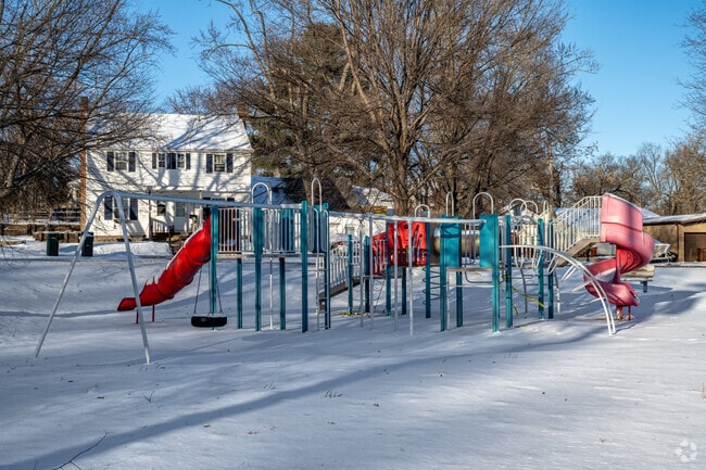 Families enjoy the playground at Kessler Park.