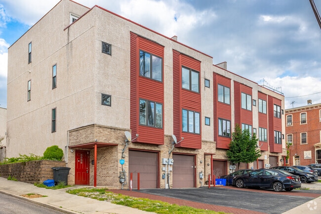 Contemporary condos in Manayunk offset filled street parking with private garages.