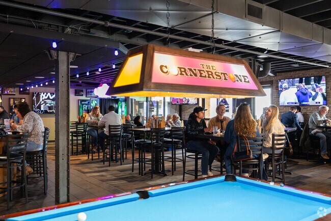 Cornerstone Sports Pub & Eatery near Lac La Belle features multiple pool tables for its patrons.