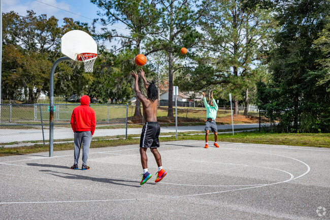 Residents practice their hoops on the basketball court at Tiger Minor Park in Ocoee..