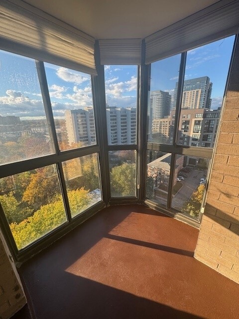 Enclosed sunroom offthe kitchen with floor to ceiling windows