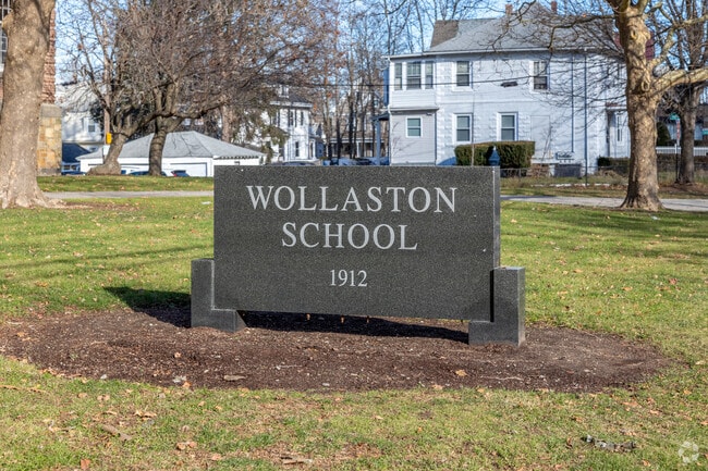 A brilliant sign sits outside Wollaston School in Quincy.