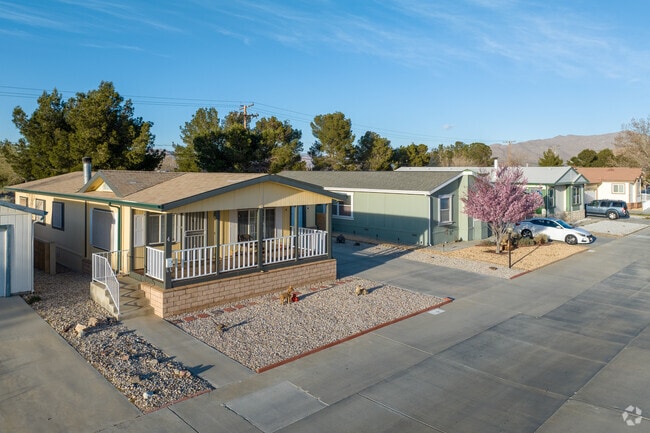 Vista Del Rosa is a gated mobile home community with amenities such as a pool and tennis court.