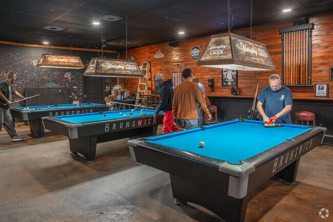 Locals play a round of pool at the local pub in Grayson.