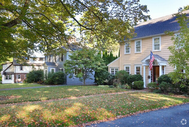 Rows of front yards stretch out to the Winchester Highlands' street.