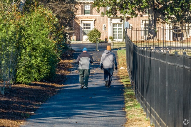 York residents enjoy a walk around the loop trail at City Park.