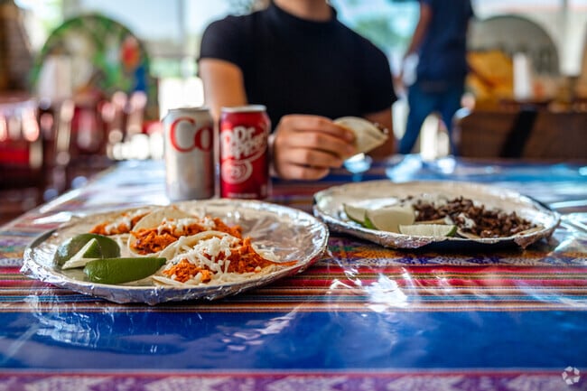 Residents enjoy street tacos at Alondra's Tacos in El Pueblo.