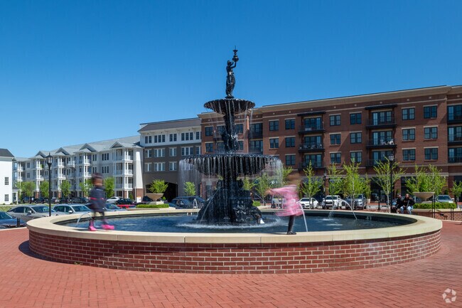 Families enjoy a park setting among residential and commercial space in Prospect.