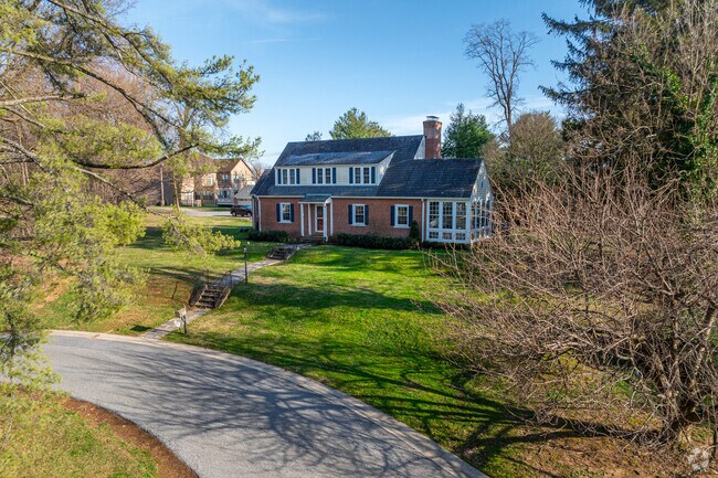 Pikesville is full of beautiful single family homes with lush green lawns, shaded by tall trees.