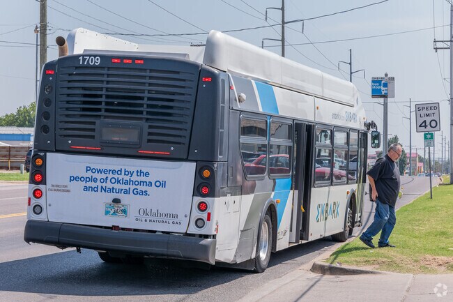 EMBARK bus stops are located along NW 10th Street and N Council Road near Sycamore Creek.