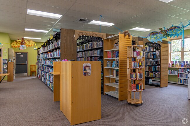 Sheridan families gather at Robert W. Rowe Library for kids’ story times.
