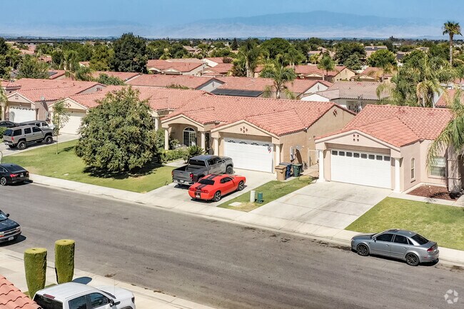 Red tile roofs in the Spanish Ranch style are spread throughout Stone Meadows.