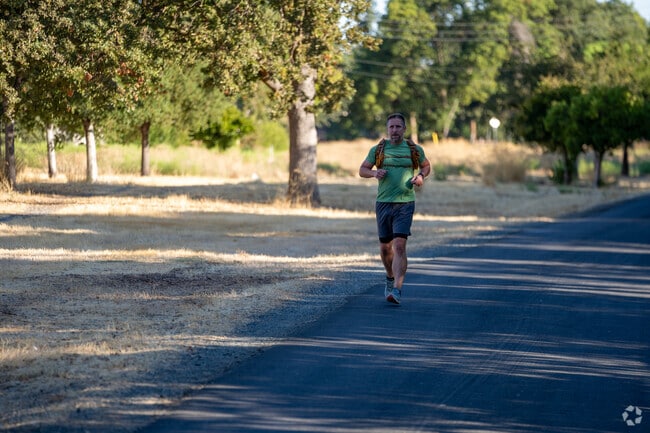 Man energizing his morning with a brisk jog along the Iron Horse Regional Trail