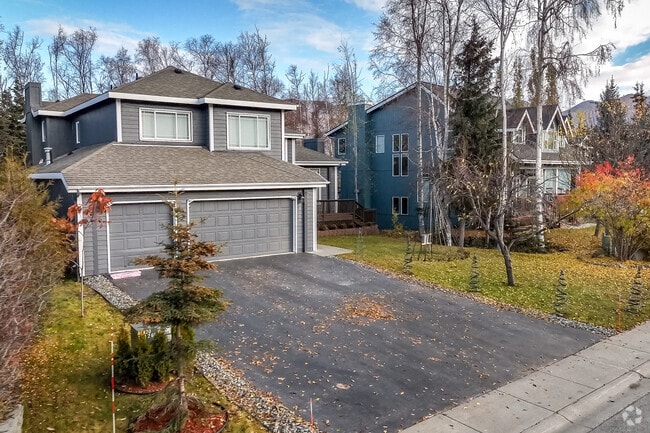 Two-story Craftsman homes with three-car garages are plentiful in the Eagle River subdivision.