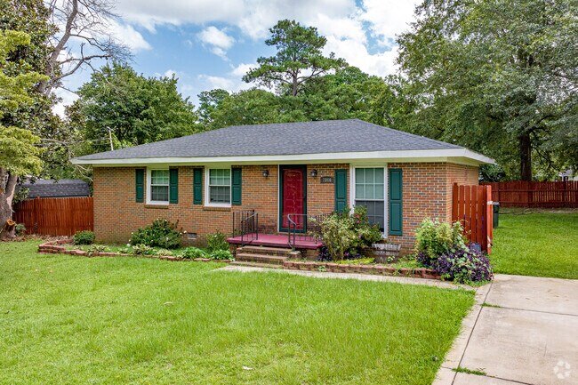 Brick ranch homes are well maintained with manicured lawns in Westover.
