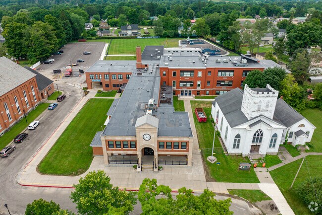 Homer Elementary School has an older building with a new addition in the back.