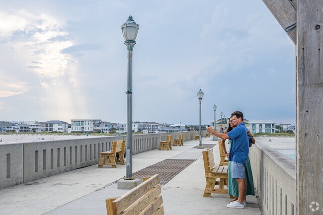 A couple from Pine Valley captures a moment at the Wrightsville Beach Pier.