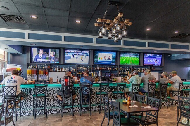 Grab a delicious margarita at Pancho Villa Grille with friends near Holly Point.