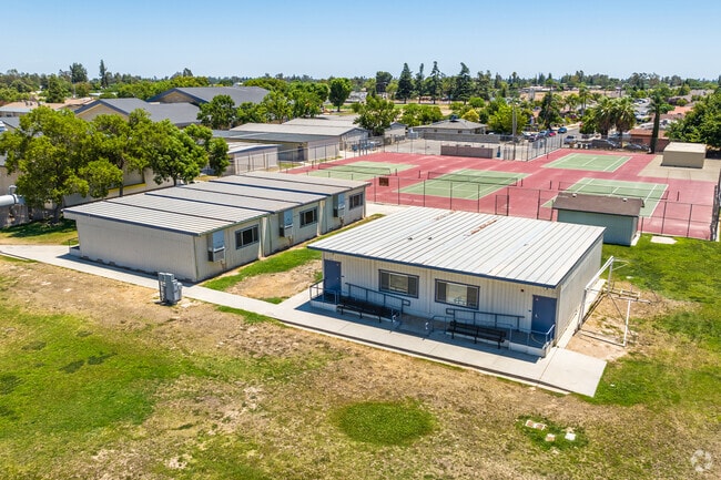 Exterior classrooms at El Capitan Middle School in Fresno surround the tennis courts.