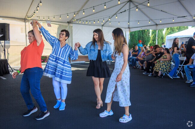 Dancing to the music Greek style at the OC Greek Fest at St John's Church in Anaheim.